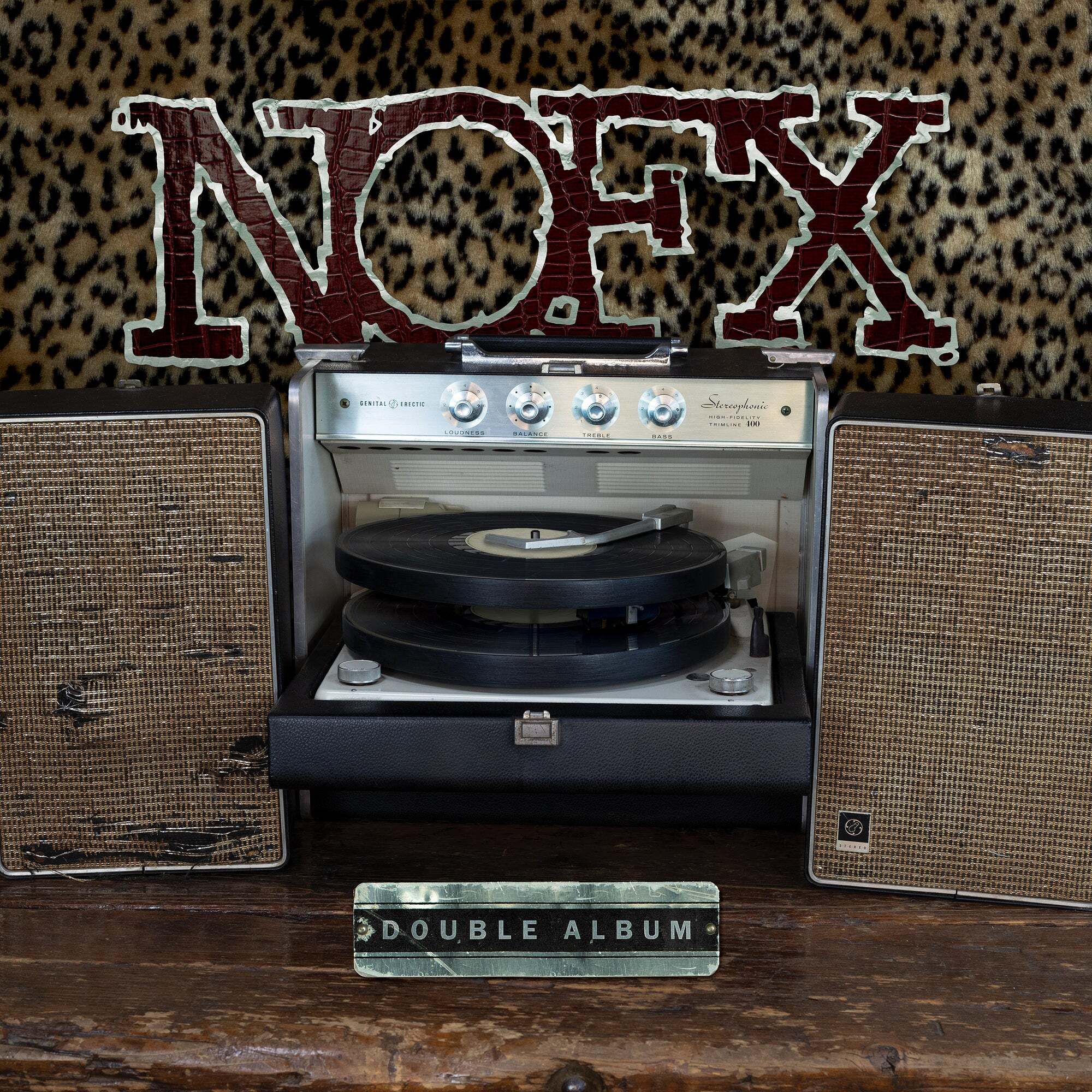 A vintage record player and two worn speakers sit before a leopard print backdrop. Above, bold, cracked red letters spell NOFX, with a Double Album label below—a must-have punk rock vinyl for true NOFX fans.