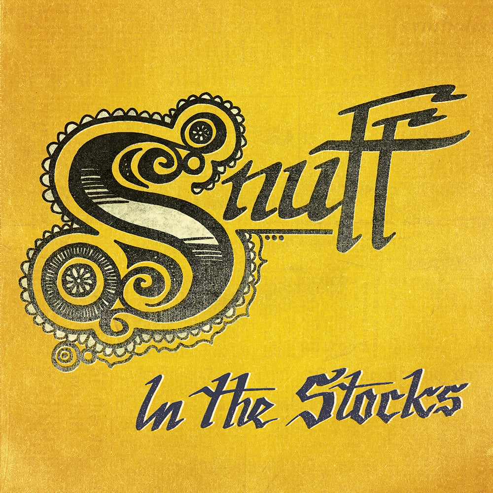 Yellow textured background with ornate, vintage-style black Snuff lettering and stylized blue In the Stocks text below. Inspired by the Demmamamussabebonk Black Vinyl 7. Brand: Snuff.