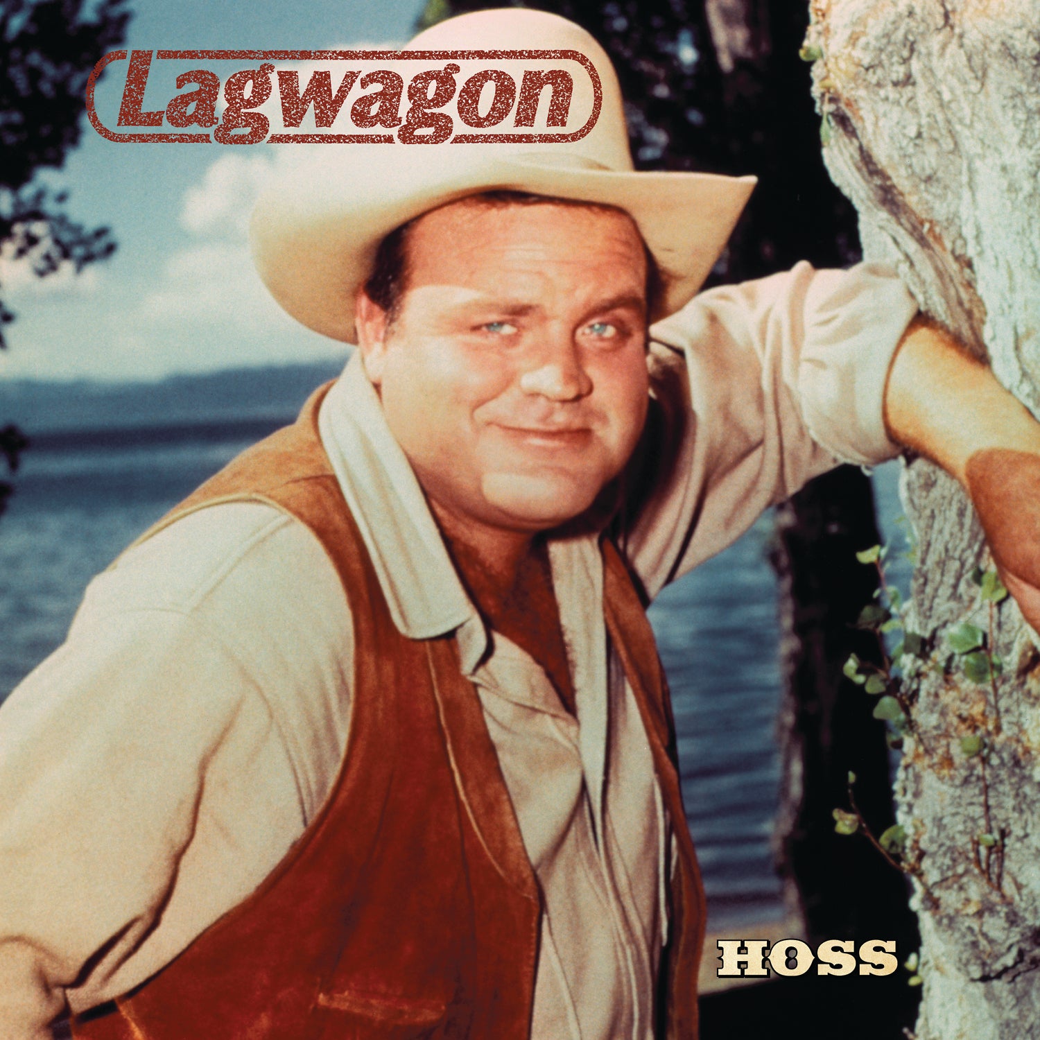A man in a cowboy hat and vest stands by a tree near a lake, smiling at the camera. Lagwagon appears at the top, with hints of unreleased tracks from the Black Vinyl 2xLP.