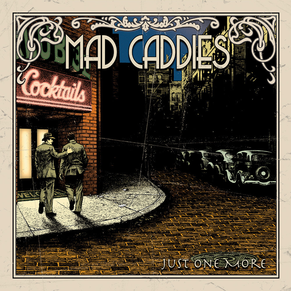 Two men in suits walk toward a neon Cocktails sign on a brick building at night as vintage cars line the street. Mad Caddies is displayed at the top with Just One More below, reflecting the bands signature punk ska reggae vibe.