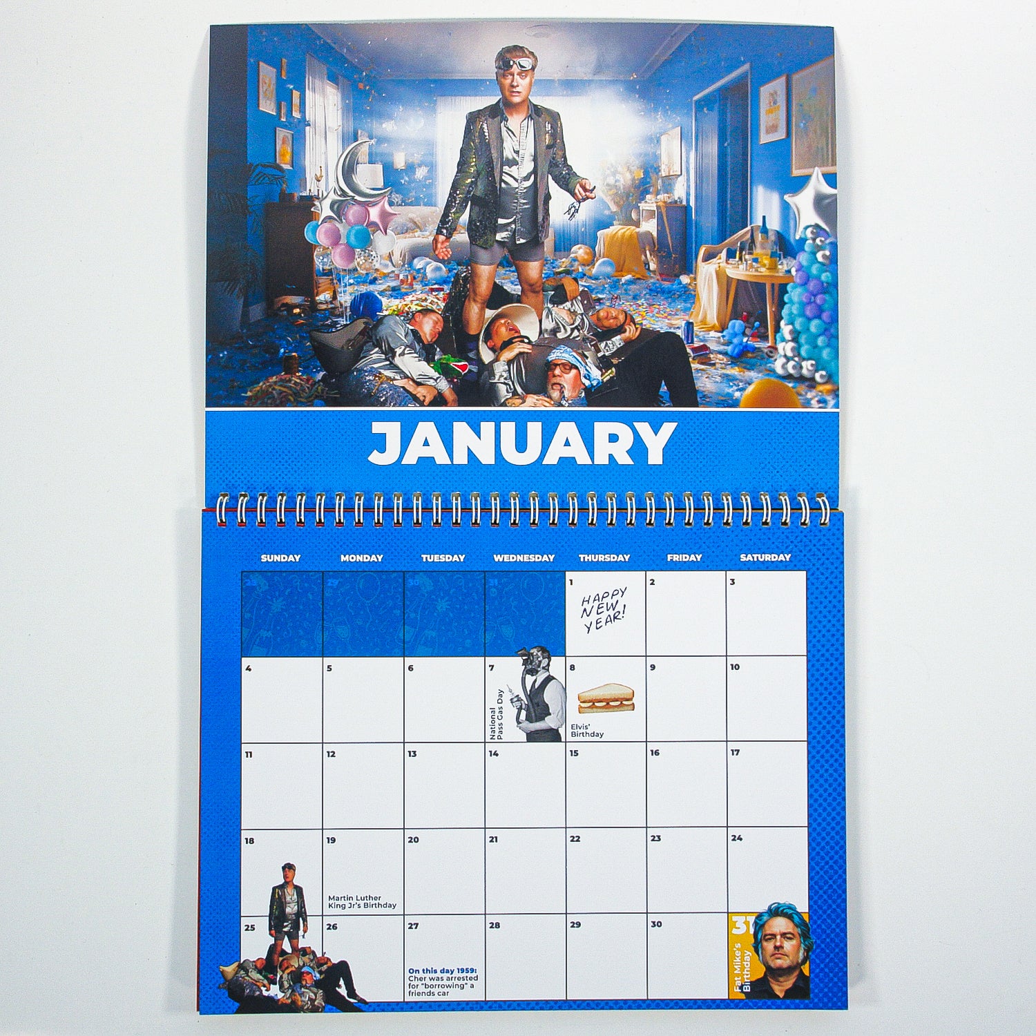 A January calendar page from Spike and The Gimme Gimmes features a person in a festive outfit amid balloons in a Flexi room, a “Happy New Year!” note, calendar grid, and their small photo in the lower left corner.