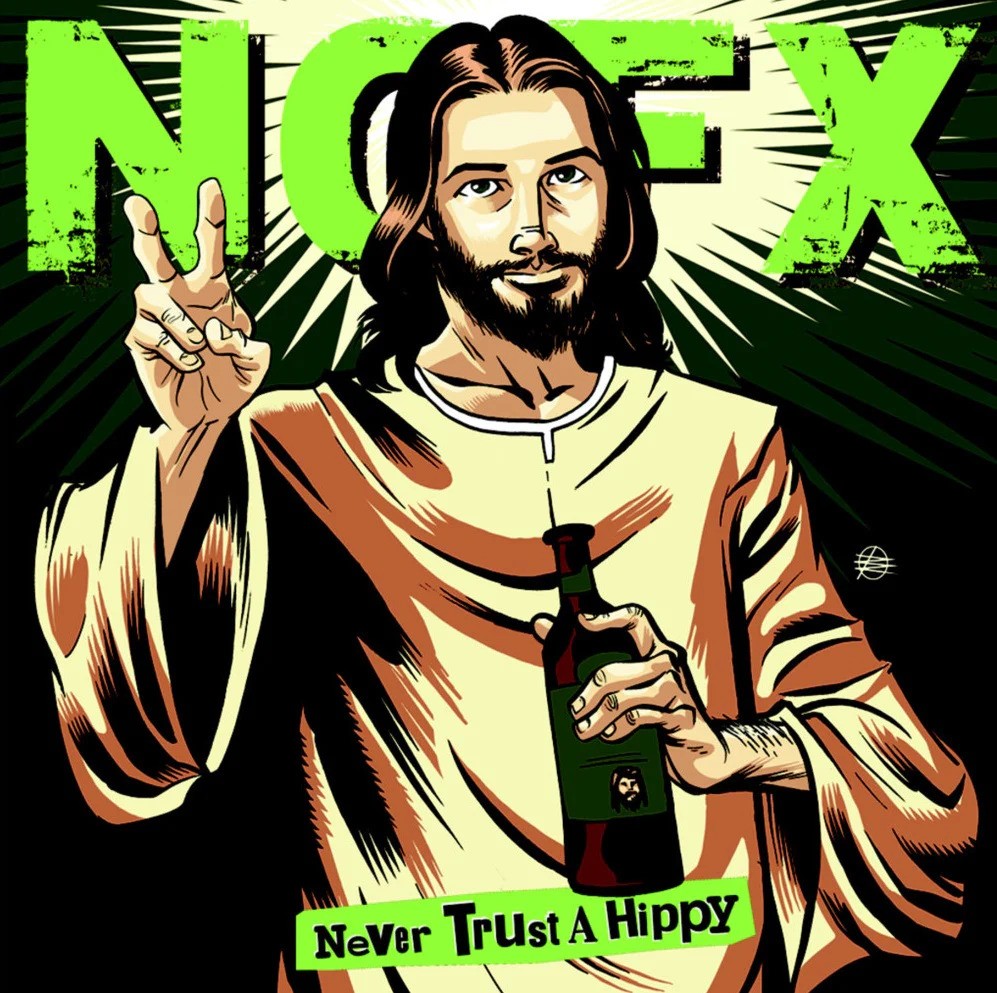 A cartoon Jesus flashes a peace sign and holds a bottle. Behind him, bold green NOFX text sits over Never Trust A Hippy. Yellow rays shine from his head, referencing the Black Vinyl 10 NOFX EP era and the Wolves In Wolves’ Clothing album. Brand: NOFX.